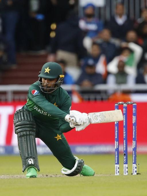 16th June 2019, Old Trafford, Manchester, England; ICC World Cup Cricket, India versus Pakistan; Fakhar Zaman of Pakistan plays a sweep shot PUBLICATIONxINxGERxSUIxAUTxHUNxSWExNORxDENxFINxONLY ActionPlus12144781 AlanxMartin