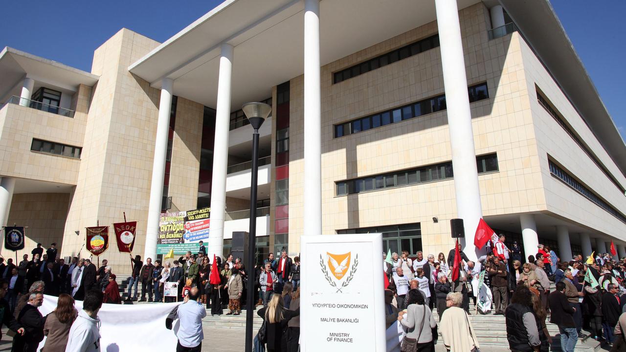 Demonstrators surround the Cypriot Ministry of Finance during a protest against austerity measures in Nicosia, Cyprus, 08 February 2014. The protest against austerity measures imposed by the troika was held outside the Ministry of Finance. 