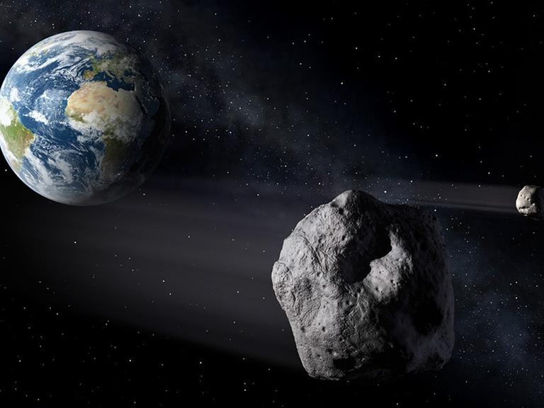 Schwein gehabt: Ein Asteroid mit Mond zieht knapp an der Erde vorbei (Zeichnung).
