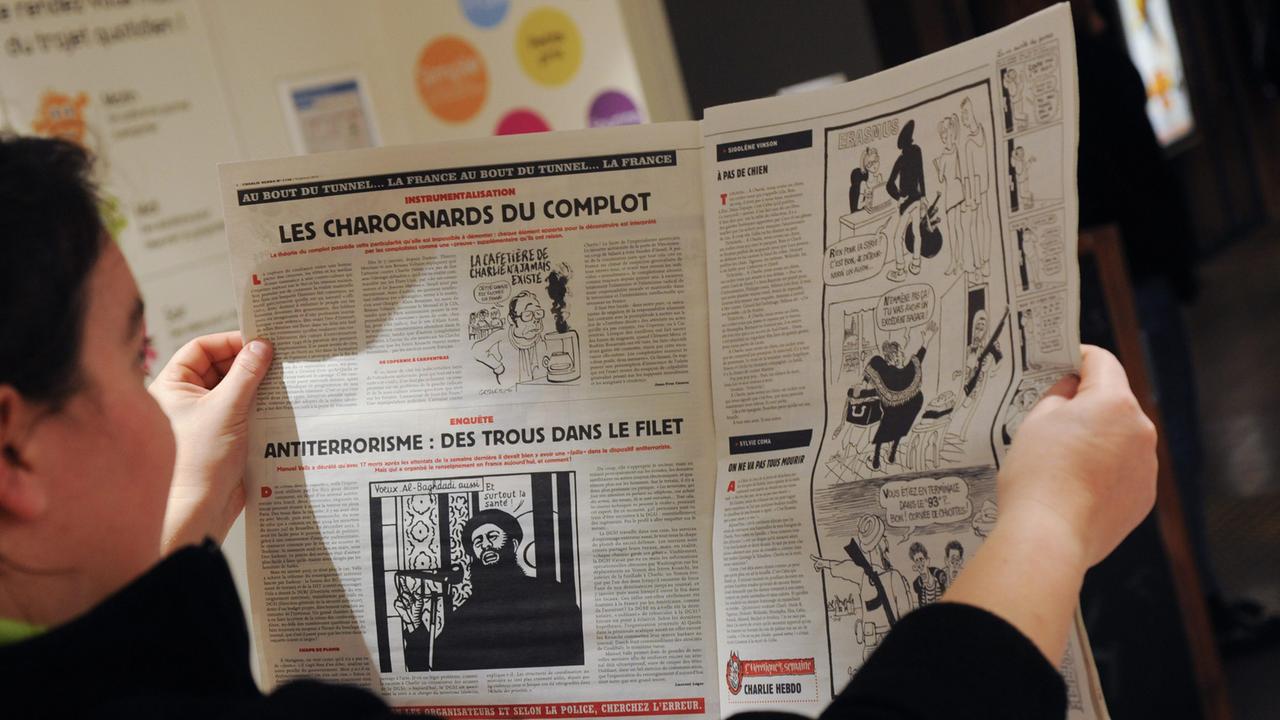 Ein Blick in die erste "Charlie-Hebdo"-Ausgabe nach dem Pariser Anschlag