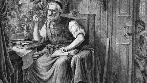 Der Nürnberger Meistersinger Hans Sachs (historischer Stich), schwarz-weiß, an einem Schreibtisch sitzend