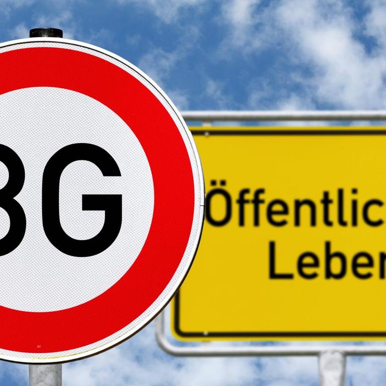 Schild mit Aufschrift 3G steht vor einem Ortsschild mit der Aufschrift "Öffentliches Leben".