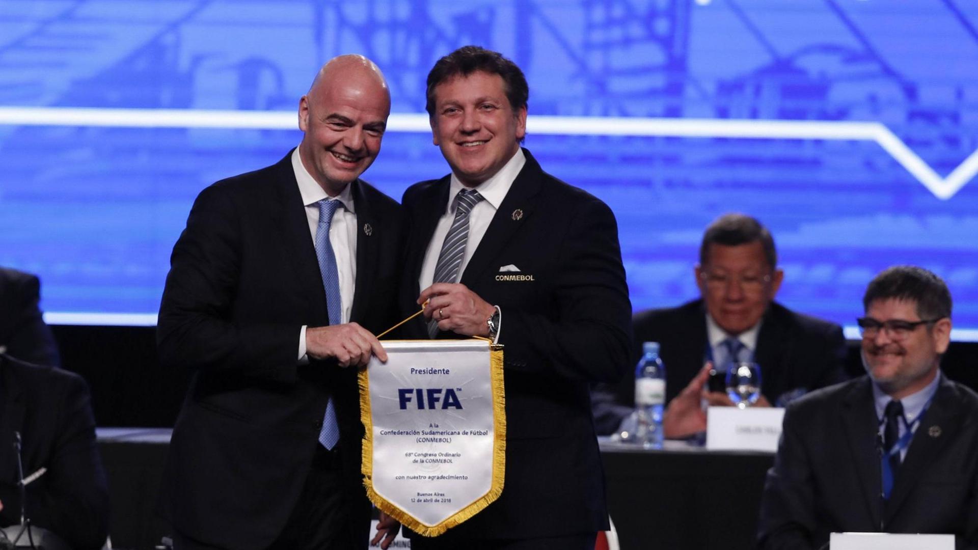 FIFA s President Gianni Infantino (L) poses with Conmebol s President Alejandro Dominguez during the start of the 68th Ordinary Congress of the South American Football Confederation (Conmebol), in Buenos Aires, Argentina, on 12 April 2018. The Conmebol awarded Argentiniain President Mauricio Macri its highest decoration today, for his contribution to South American football as president of Boca Juniors (1995-2008) at the beginning of the 68th Ordinary Congress of the entity. Conmebol gives maximum award to Macri for his contribution to soccer !ACHTUNG: NUR REDAKTIONELLE NUTZUNG! PUBLICATIONxINxGERxSUIxAUTxONLY Copyright: xDavidxFernandezx BAS03 20180412-636591584544042916