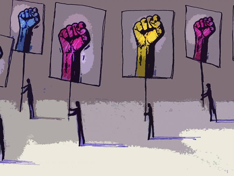 Demonstranten tragen Plakate mit Fäusten