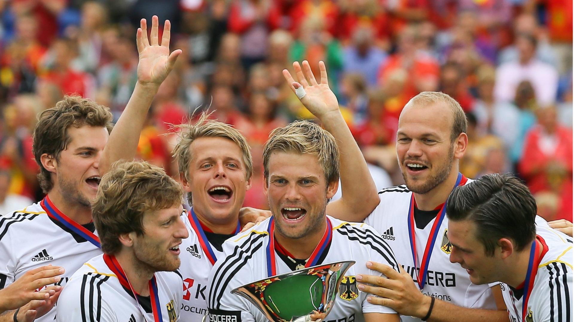 German team celebrate with the cup after winning the gold medal in their Final against Belgium during the EuroHockey 2013 in Boom, near Antwerp, Belgium, 25 August 2013. (recropped version) German team celebrate with the cup after winning the gold medal in their Final against Belgium during the EuroHockey 2013 in Boom, near Antwerp, Belgium, 25 August 2013. (recropped version)