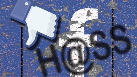 Facebook-Symbole und darüber steht "Hass" gesprüht.