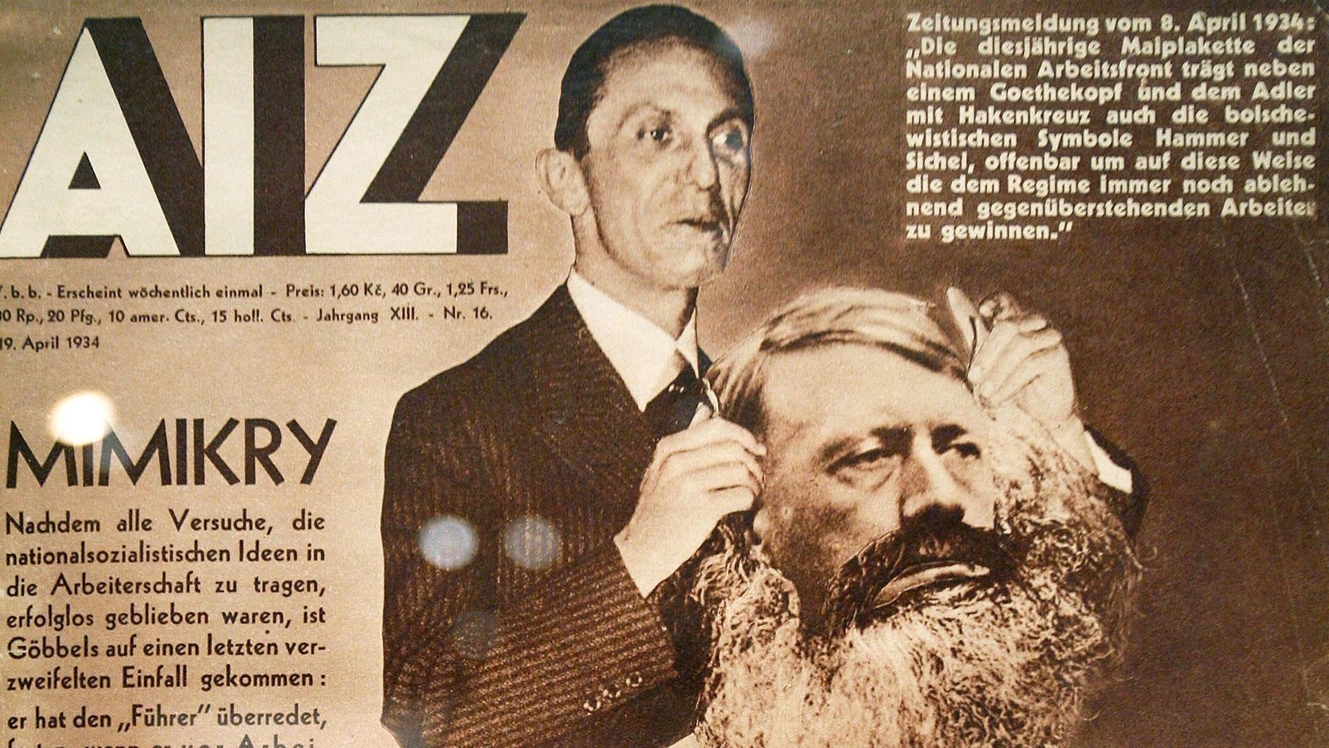 Die Titelseite der Arbeiter Illustrierten Zeitung (AIZ) mit der Fotomontage "Mimikry" aus dem Jahr 1934 von John Heartfield in der Kölner Ausstellung "Marinus - Heartfield - Politische Fotomontage der 1930er Jahre".
