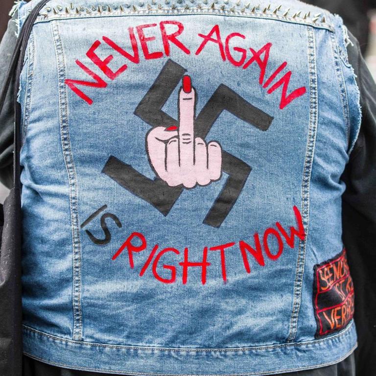 May 1, 2020, Munich, Bavaria, Germany: Never again or nie wieder with a swastika used to demonstrate against the III. Weg neonazi group in Munich, Germany. Despite the ongoing Coronavirus crisis, 14 from the militant neonazi group III. Weg demonstrated this May 1st in the Pasing district of Munich, Germany. On the heels of a rejection of their normal May Day demonstration in Erfurt and the cancellation of the Roland Elstner Mahnwache, the group decided to organize a demo in Munich due to more permissiveness by the city during the Coronavirus crisis. Approx. 150 counterdemonstrators attended with reports of unprovoked attacks by USK police at the scene including against reporters and attempts at press freedom restrictions. III. Weg is the continuation of the banned criminal group Freies Netz Sued in Munich and among its ranks ar - ZUMAb160 20200501_zbp_b160_031 Copyright: xSachellexBabbarx  Download Highres