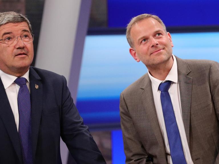 Der Spitzenkandidat der Partei Alternative für Deutschland (AfD), Leif-Erik Holm (r) und der Spitzenkandidat der CDU, Lorenz Caffier.