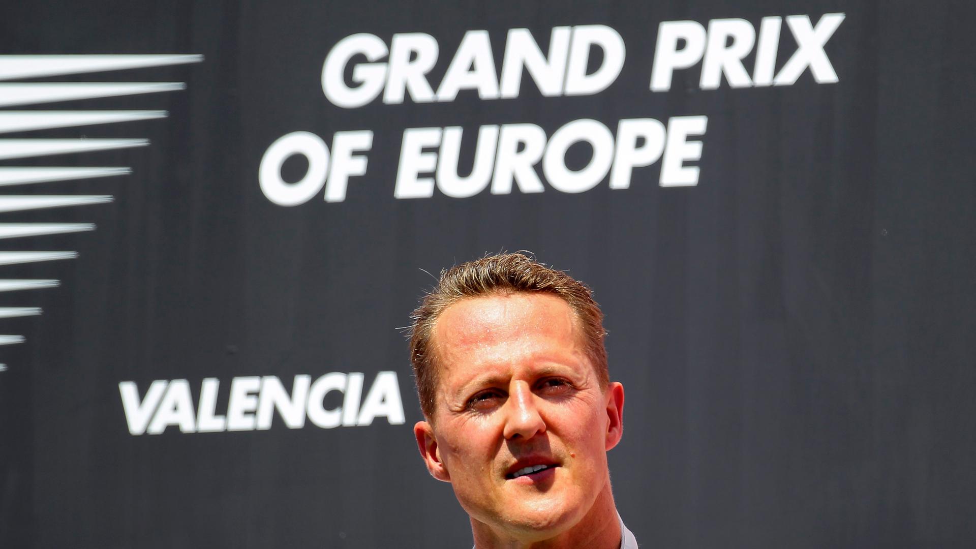 epa03279638 German Formula One driver Michael Schumacher of Mercedes AMG is seen on the podium after taking the third place in the 2012 Formula One Grand Prix of Europe at the Valencia street circuit in Valencia, Spain, 24 June 2012. EPA/VALDRIN XHEMAJ epa03279638 German Formula One driver Michael Schumacher of Mercedes AMG is seen on the podium after taking the third place in the 2012 Formula One Grand Prix of Europe at the Valencia street circuit in Valencia, Spain, 24 June 2012. EPA/VALDRIN XHEMAJ
