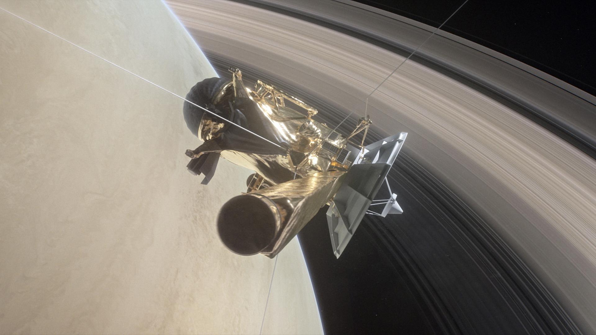 Die von der NASA am 25.04.2017 veröffentlichte Illustration zeigt, wie die Raumsonde «Cassini» zwischen dem Planet Saturn und dessen inneren Ringen kreist.