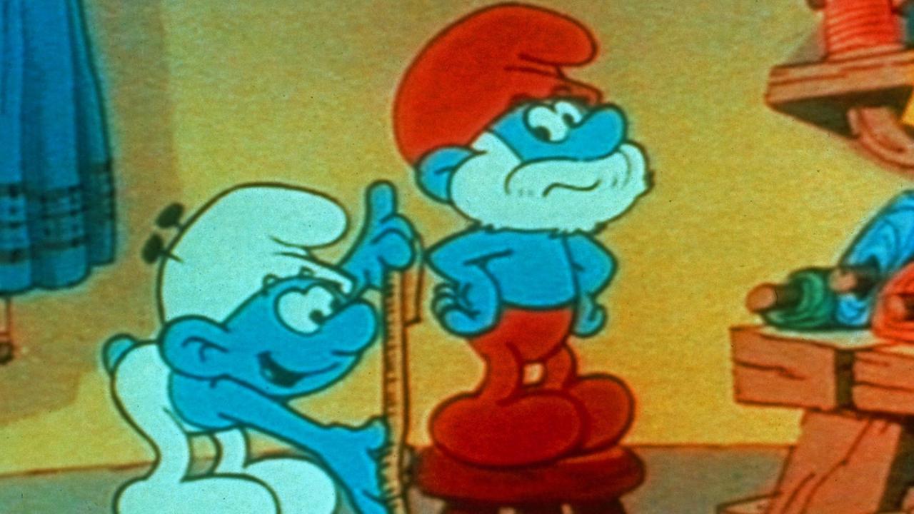 Die Schlümpfe - Szene aus der Zeichentrickserie der frühen 80er Jahre, die im Fernsehen gezeigt wurde. Zu sehen ist Papa Schlumpf beim Schneider.