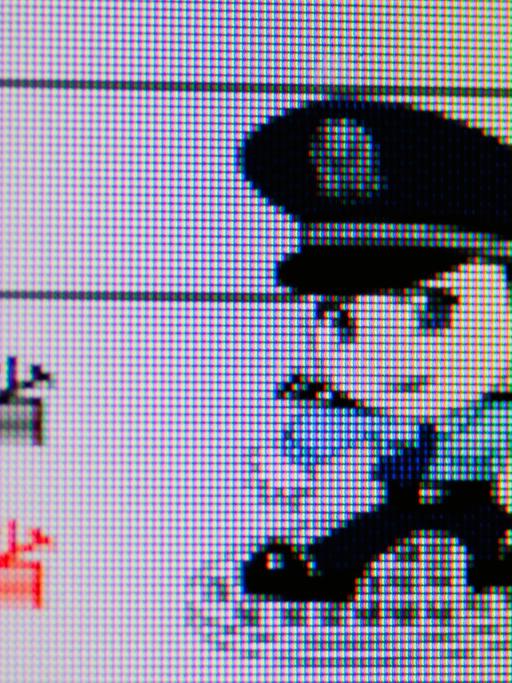 Ein Symbolbild eines Polizeibeamten auf dem Bildschirm, das chinesische Internetnutzer davor warnt, die Zensurgesetze nicht zu überschreiten.
