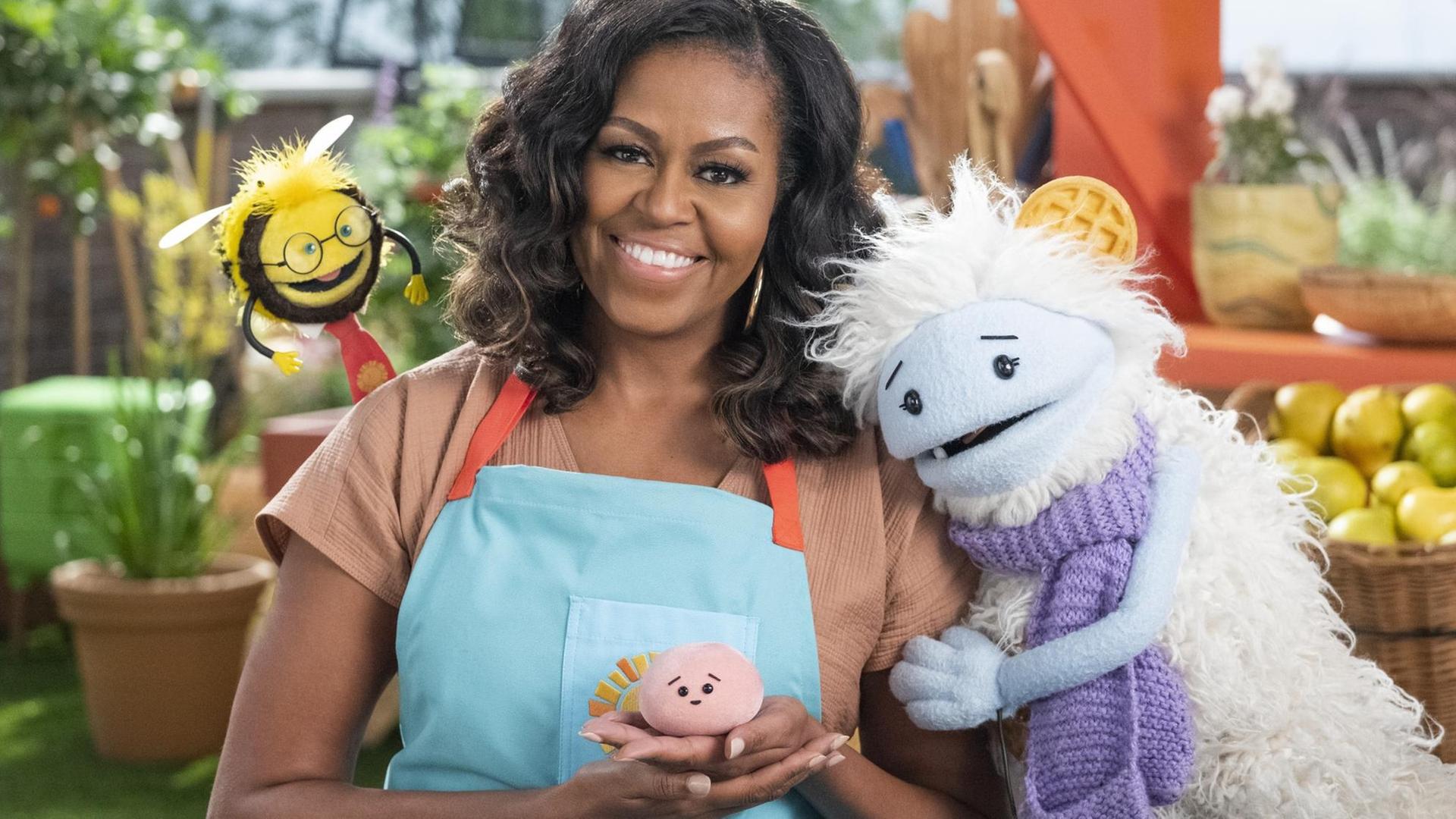 Michelle Obama mit einer Puppe in der Netflix-Show "Waffles + Mochis".