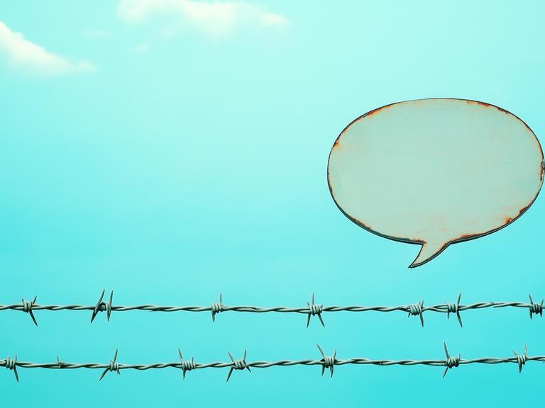 Sprechblase über Stacheldraht Sprechblase über Stacheldraht