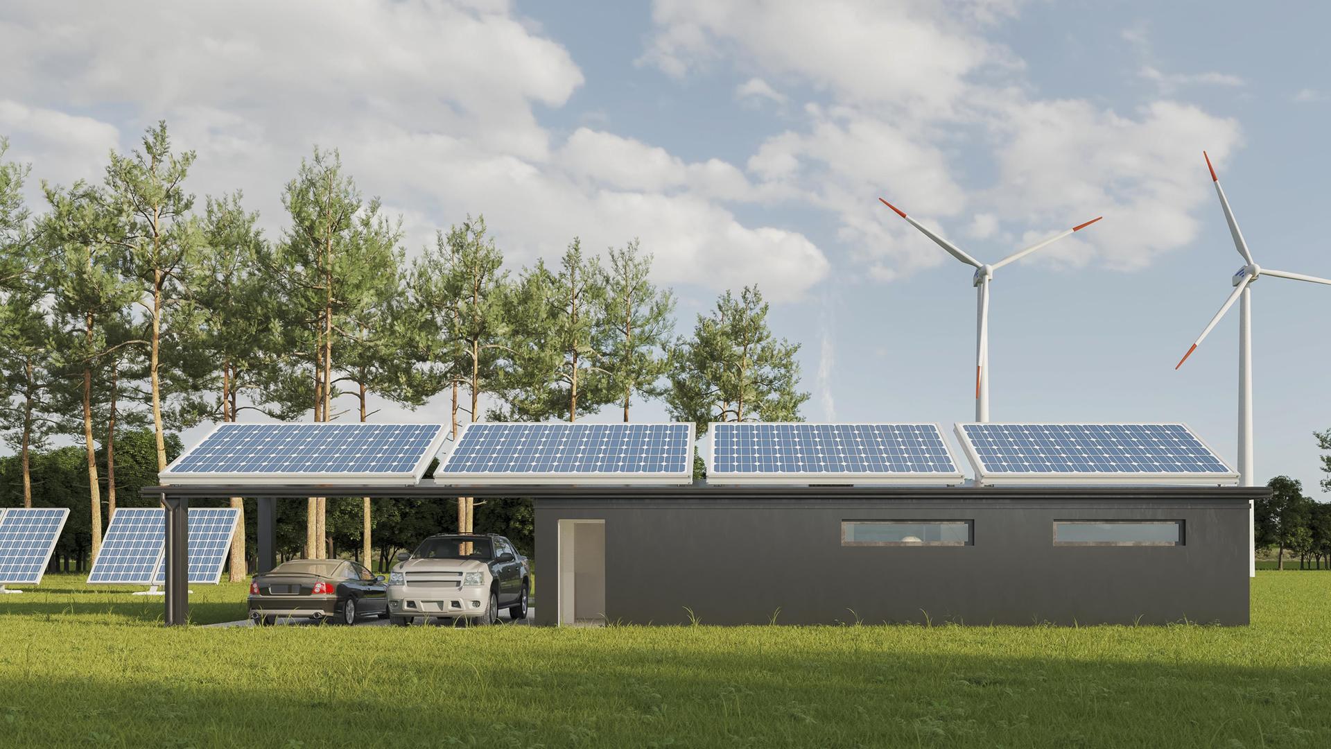 Ein Haus mit Solar-Panelen. Daneben steht ein Windrad