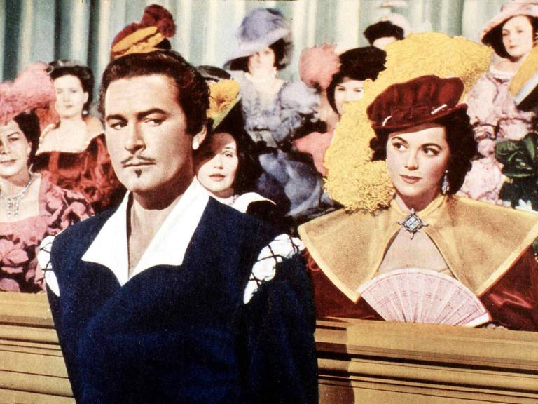 Wir sehen den Schauspieler Errol Flynn in der Rolle des Don Juan Wir sehen den Schauspieler Errol Flynn in der Rolle des Don Juan