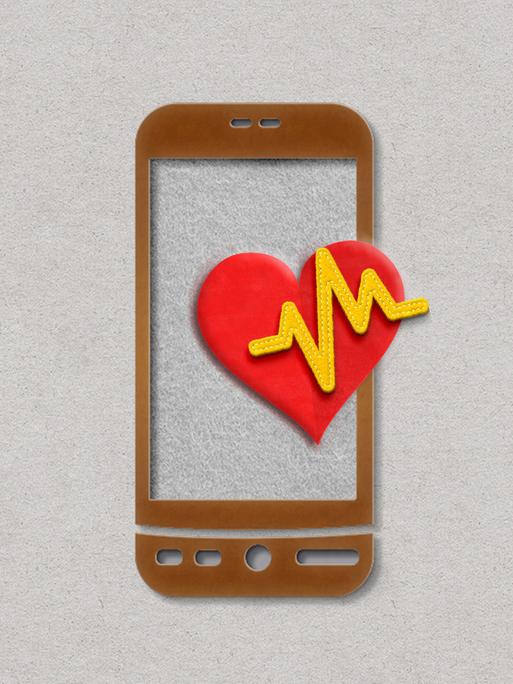 Papierschnitt eines Mobiltelefons mit rotem Herz und und EKG-Kurve. 