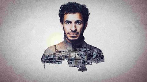 Das Bild eines Mannes über eine auf dem Kopf stehende, im syrischen Bürgerkrieg zerstörte Stadtlandschaft gelegt. Ein Doppelbelichtungseffekt.