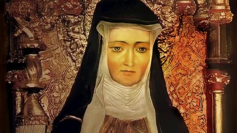 Figur der Hildegard von Bingen, Sibylle vom Rhein, deutsche Benediktineräbtissin und Universalgelehrte. Sie trägt ein schwarzes Kopftuch.