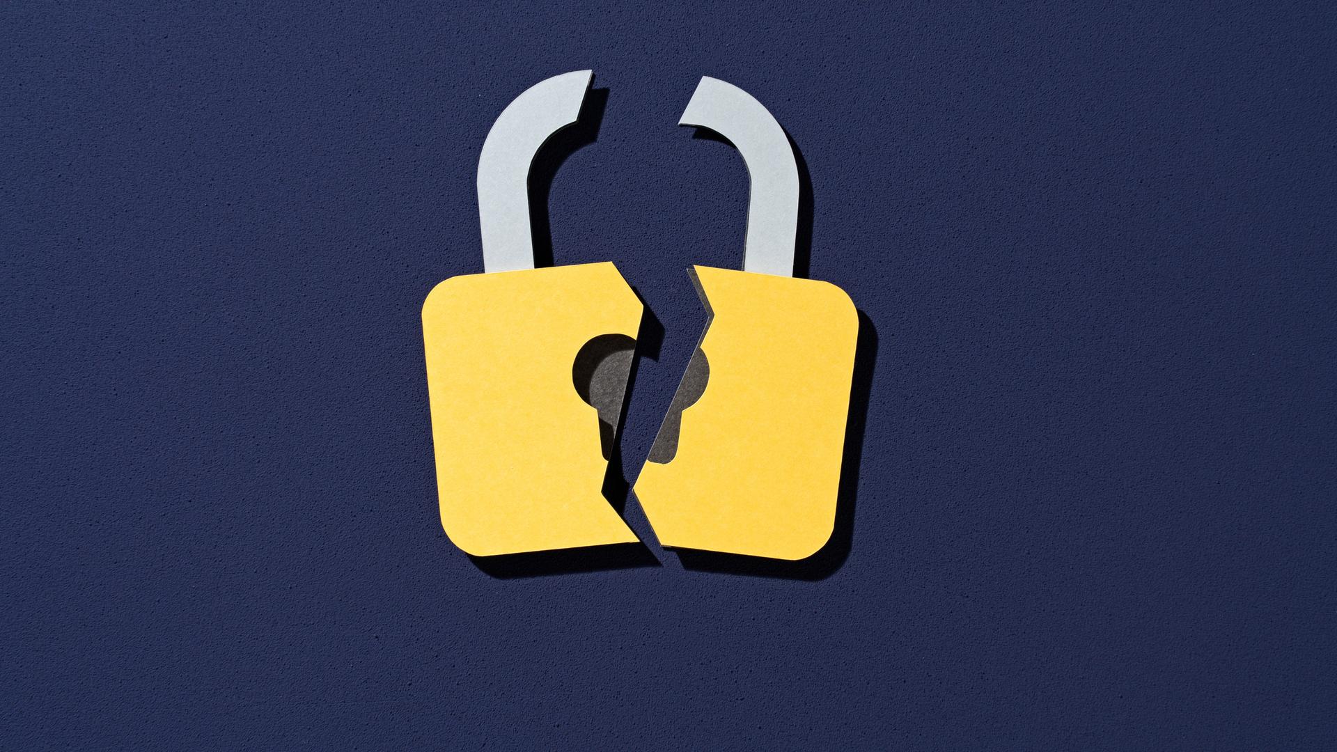 Papierschnitt eines Schlosses, das in der Mitte zerbrochen ist.