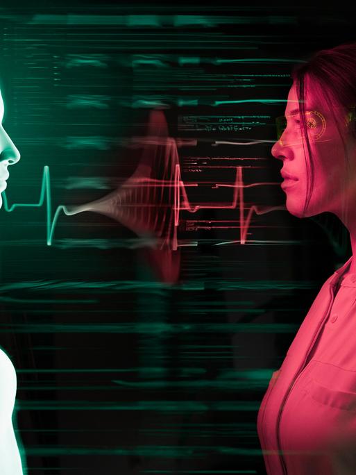 Das Symbolbild zeigt eine künstliche Intelligenz, der ein Mensch gegenübersteht.