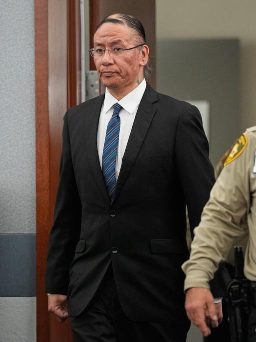 Nathan Chasing Horse, center, walks back into the courtroom after a break in his trial on charges of sexually abusing Indigenous women and girls Tuesday, Jan. 20, 2026, in Las Vegas. (AP Photo/John Locher)