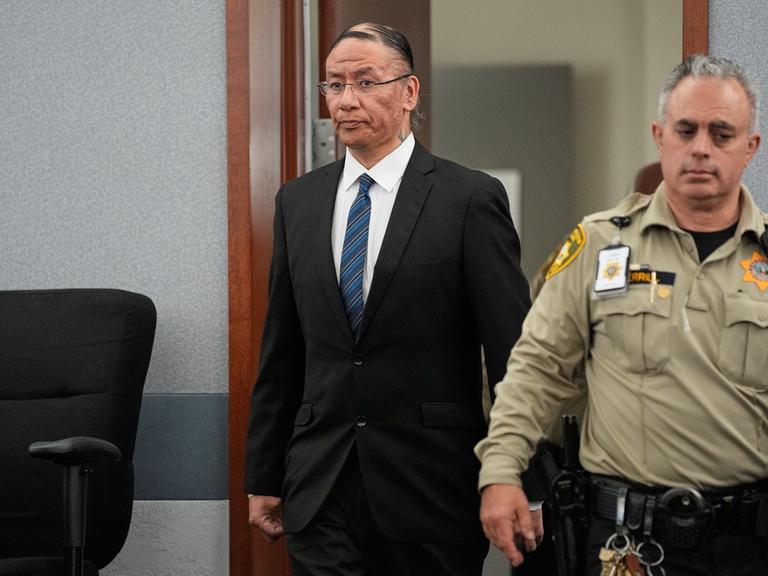 Nathan Chasing Horse, center, walks back into the courtroom after a break in his trial on charges of sexually abusing Indigenous women and girls Tuesday, Jan. 20, 2026, in Las Vegas. (AP Photo/John Locher)