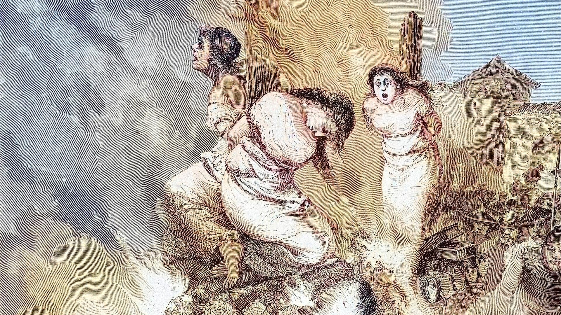 Hexenverbrennung im Mittelalter: Drei Frauen auf dem brennenden Scheiterhaufen (historischer Stich von 1883)