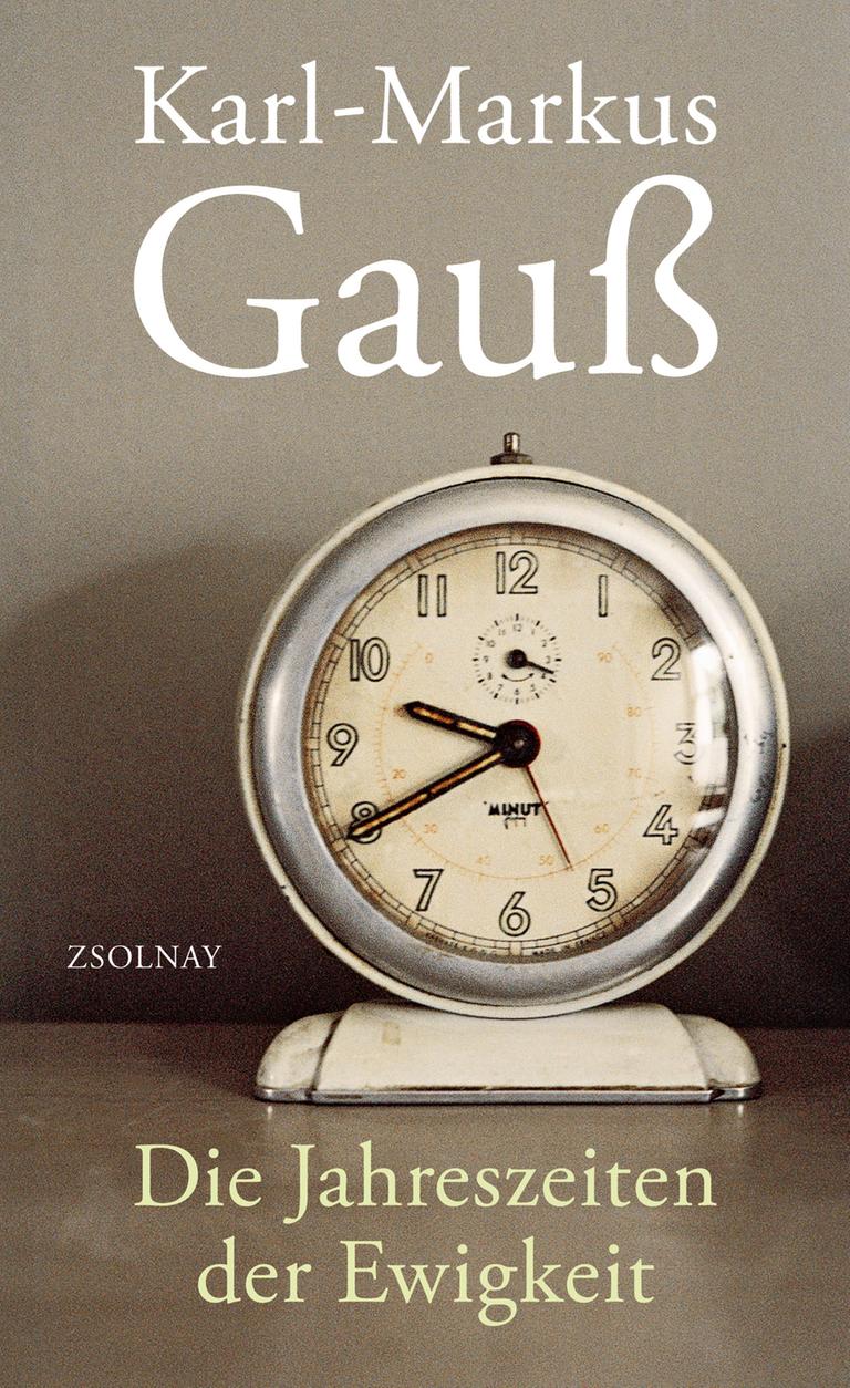 Cover des Buches "Die Jahreszeiten der Ewigkeit" von Karl-Markus Gauß. Auf grauem Untergrund ist eine Uhr zu sehen. 