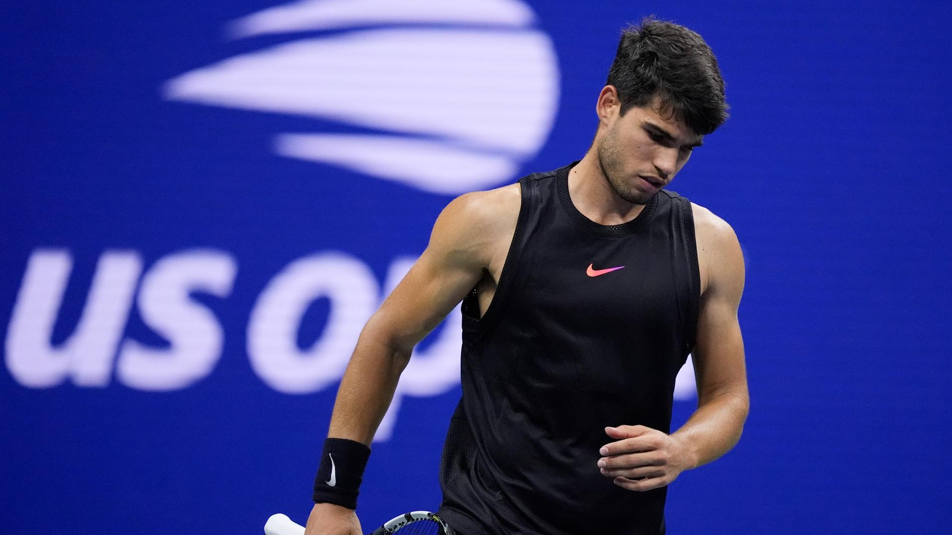 Carlos Alcaraz, of Spain, reacts after losing to Botic van De Zandschulp, of the Netherlands, during the second round of the U.S. Open tennis championships, Thursday, Aug. 29, 2024, in New York. (AP Photo/Matt Rourke)