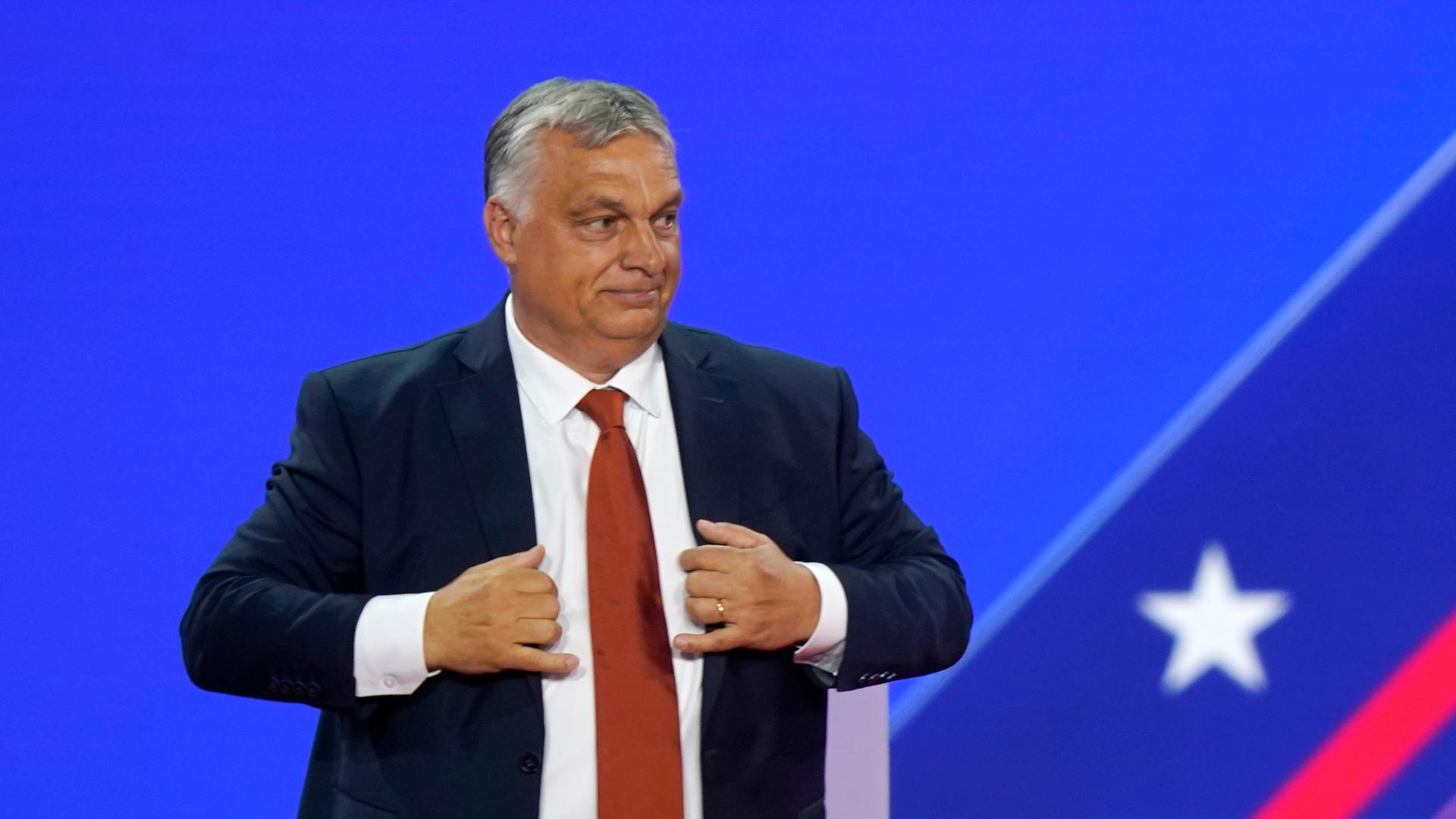 Hungarian Prime Minister Viktor Orban adjusts his jacket after speaking at the Conservative Political Action Conference (CPAC) in Dallas, Thursday, Aug. 4, 2022. (AP Photo/LM Otero)