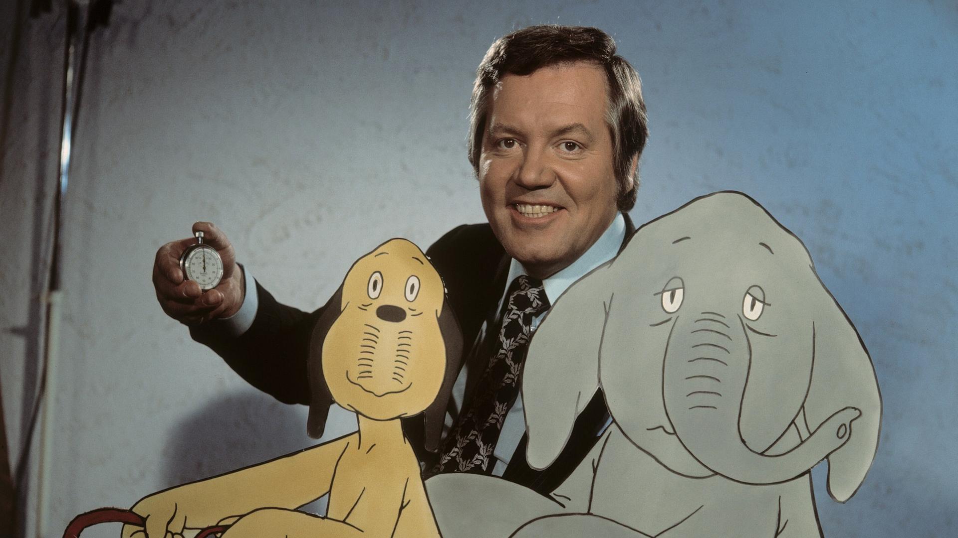 Wim Thoelke mit den beiden Figuren Wum und Wendelin aus der Show "Der Große Preis". Wim Thoelke mit den beiden Figuren Wum und Wendelin aus der Show "Der Große Preis".