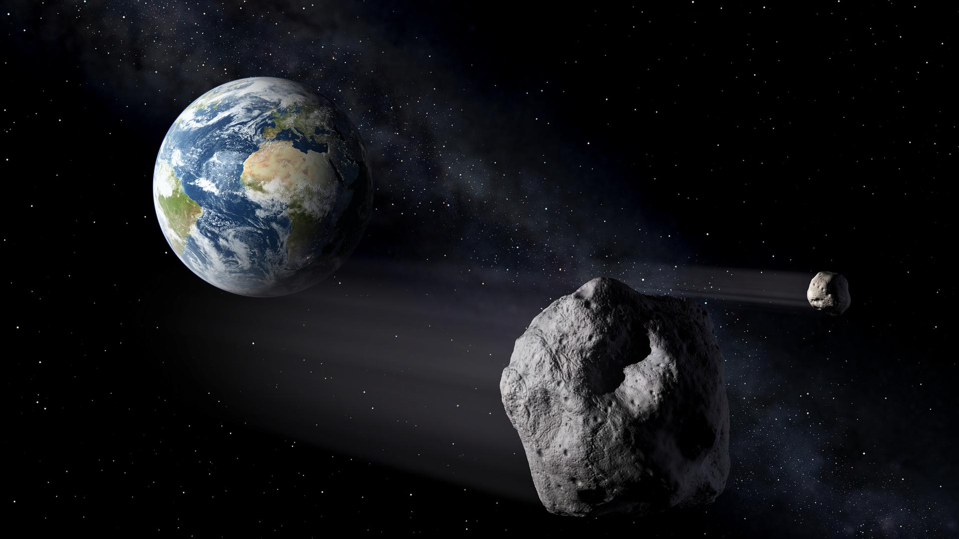  Ein Asteroid rast an der Erde vorbei (Illustration). 
