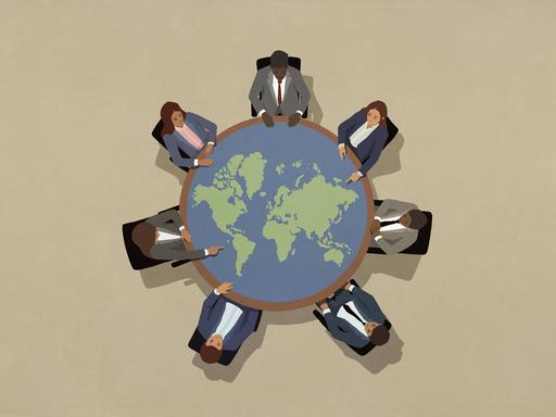 Illustration: Eine Gruppe von PolitikerInnen sitzt um einen großen runden Tisch in Form einer Weltkugel.