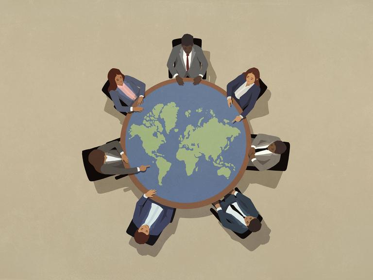 Illustration: Eine Gruppe von PolitikerInnen sitzt um einen großen runden Tisch in Form einer Weltkugel.