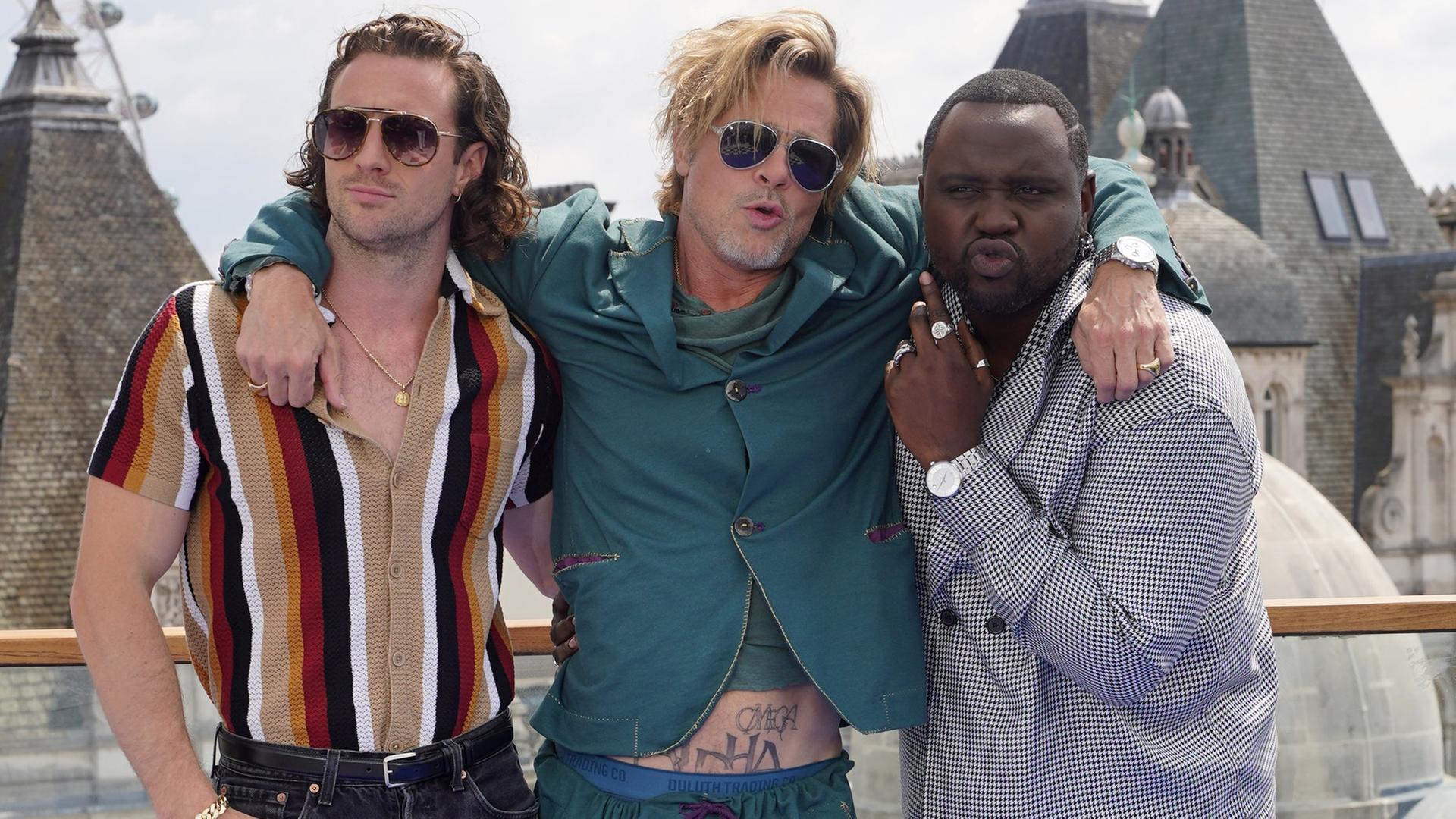 Die Besetzung aus "Bullet Train": Aaron Taylor-Johnson, Brad Pitt und Brian Tyree Henry. Die Besetzung aus "Bullet Train": Aaron Taylor-Johnson, Brad Pitt und Brian Tyree Henry.