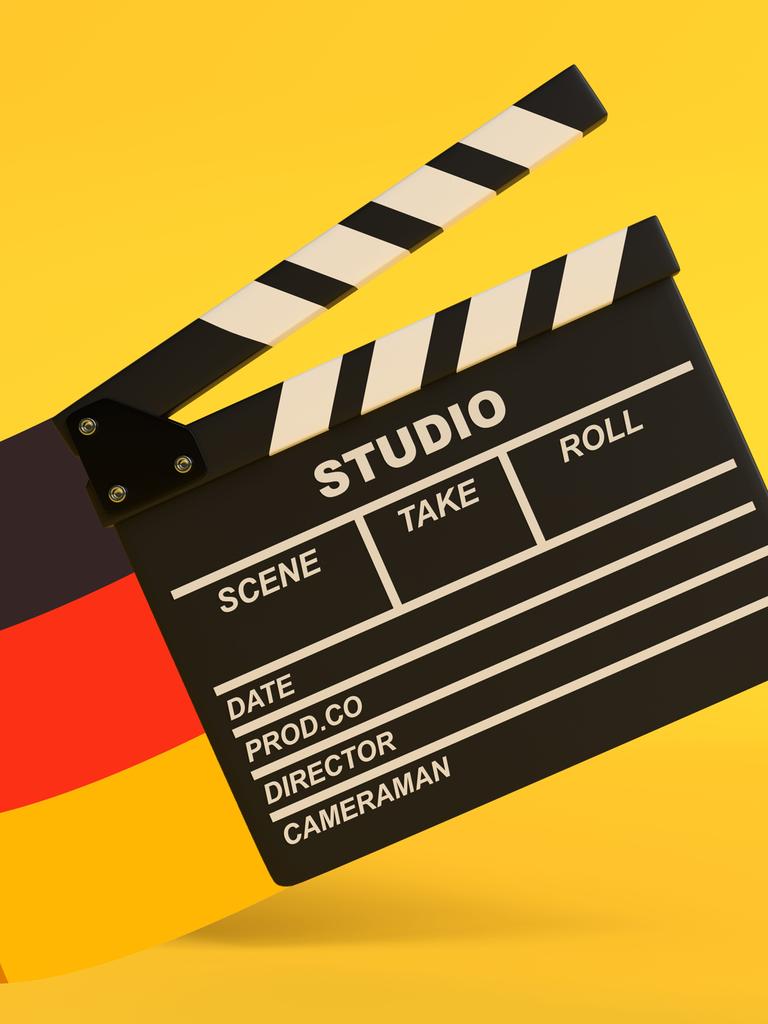 Illustration einer Filmklappe vor gelben Hintergrund. Links am Bildrand weht eine deutsche Flagge.