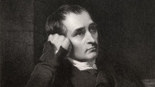 Schwarz-weiß Bild: Samuel Crompton schaut nachdenlich zur Seite.