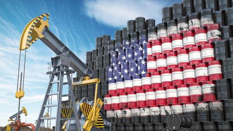 Die Illustration zeigt einen Ölpumpenheber und gestapelte Ölfässer, deren blaue und rot-weiße Färbungen die Stars-and-Stripes-Flagge der Vereinigten Staaten ergeben.