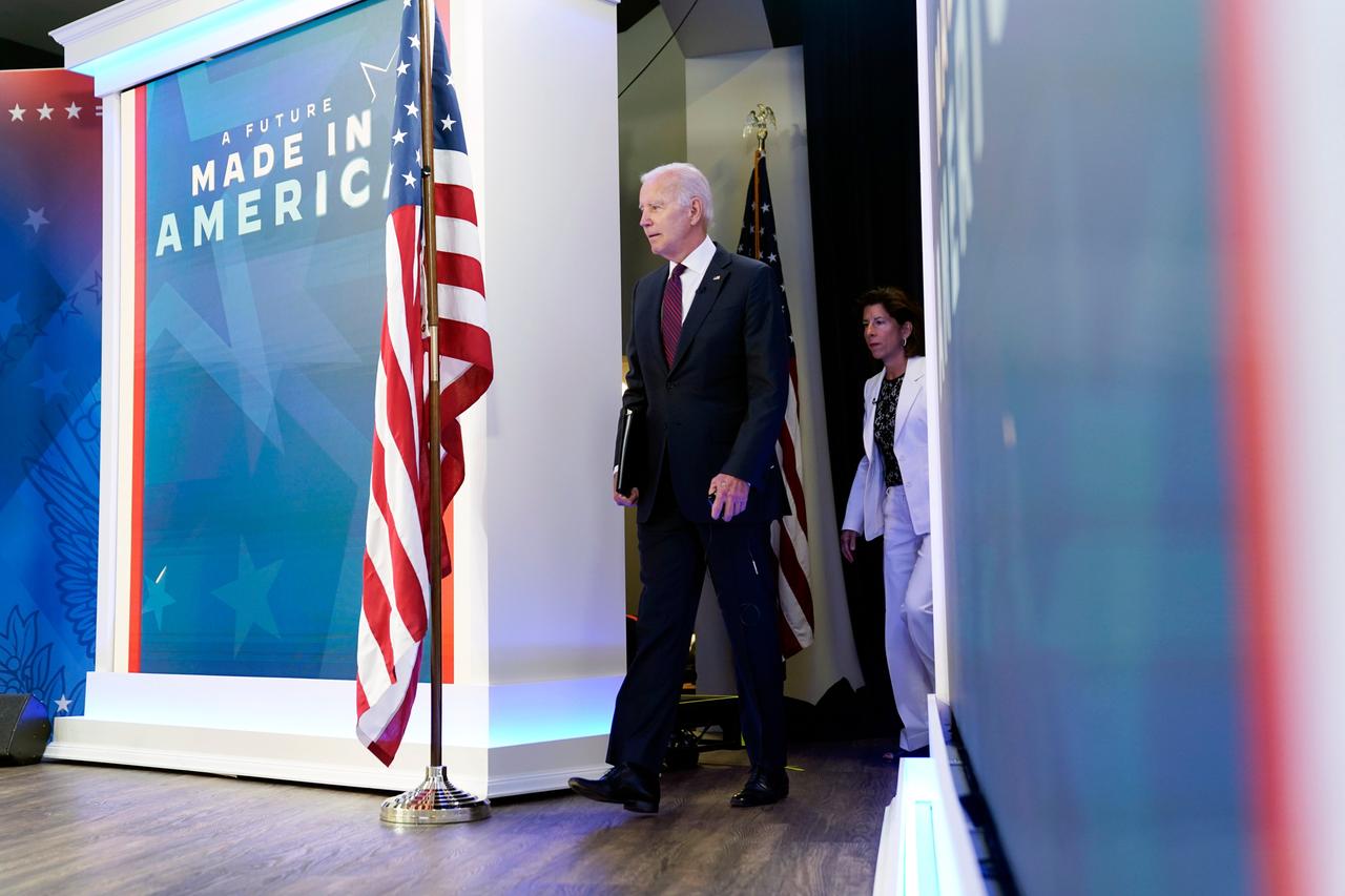 President Joe Biden arrives with Commerce Secretary Gina Raimondo to speak about the American Rescue Plan during an event in the South Court Auditorium on the White House campus, Friday, Sept. 2, 2022, in Washington. (AP Photo/Evan Vucci)