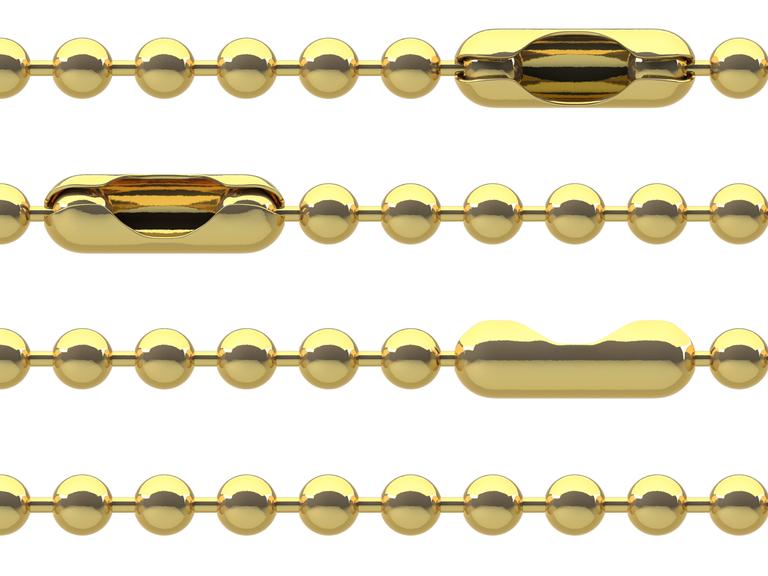 Übereinanderliegende Goldketten werden von kleinen Punkten durchbrochen.