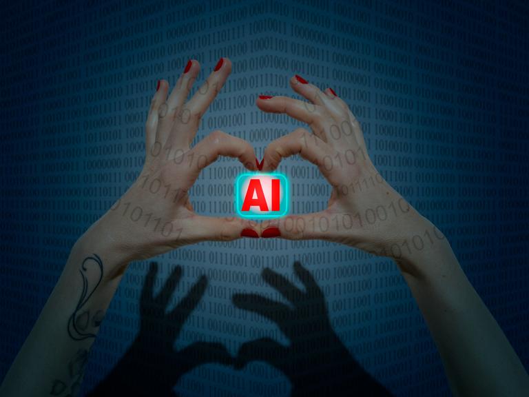 Zwei Hände mit rot lackierten Finger bilden eine Herzform in der sie ein Symbol mit dem Schriftzug AI (Artificial Intelligence) halten.