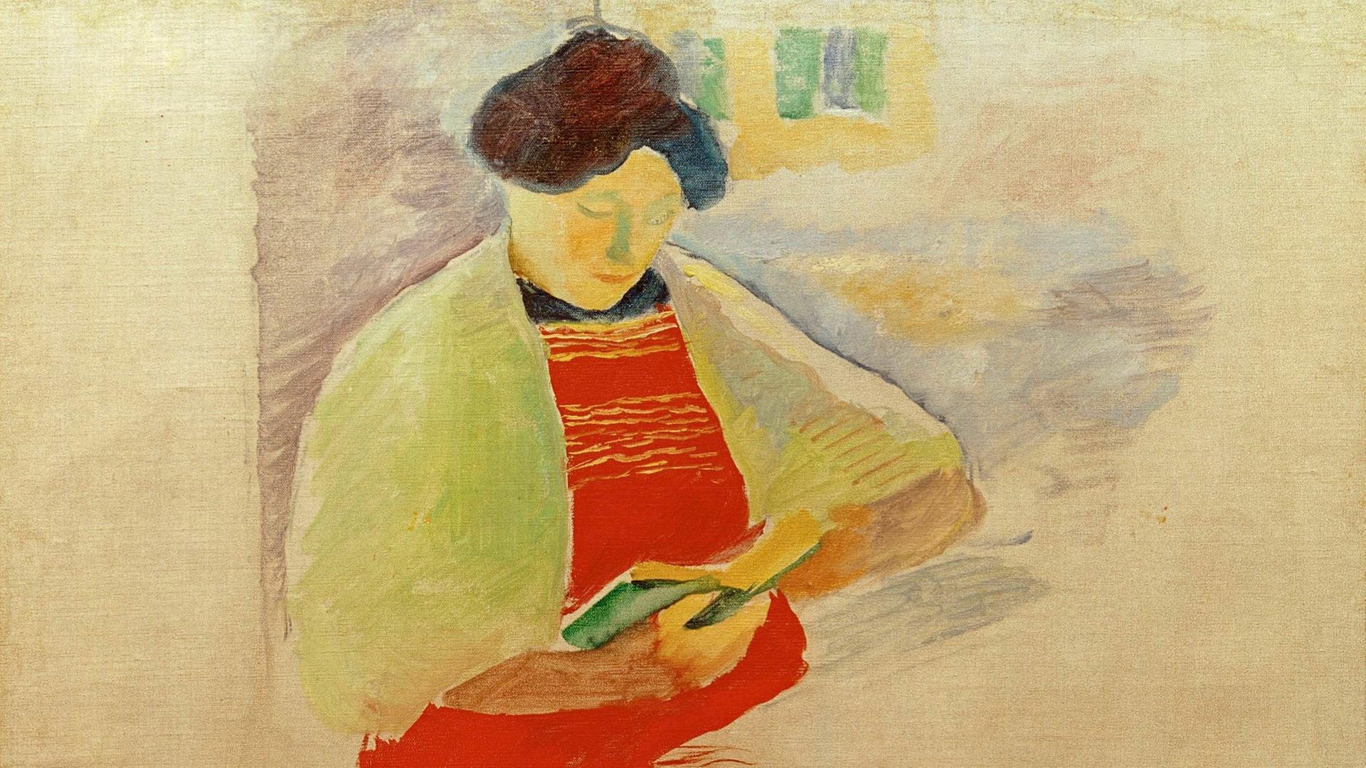 Das Bild "Frau mit roter Schürze auf Balkon (Elisabeth)" von August Macke, 1910. (Elisabeth Macke, geb. Gerhardt, lesend). Öl auf Leinwand, 67 x 49 cm.