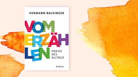 Das Cover des Buches "Vom Erzählen" von Hermann Bausinger auf orangefarbenem Pastell-Hintergrund. Zu sehen sind bunte Großbuchstaben in Regenbogenfarben, die den Titel bilden. In den Buchstaben sind Synonyme für das Wort "Erzählen" zu lesen, etwa Bericht erstatten, plaudern, schwätzen, beschreiben. 