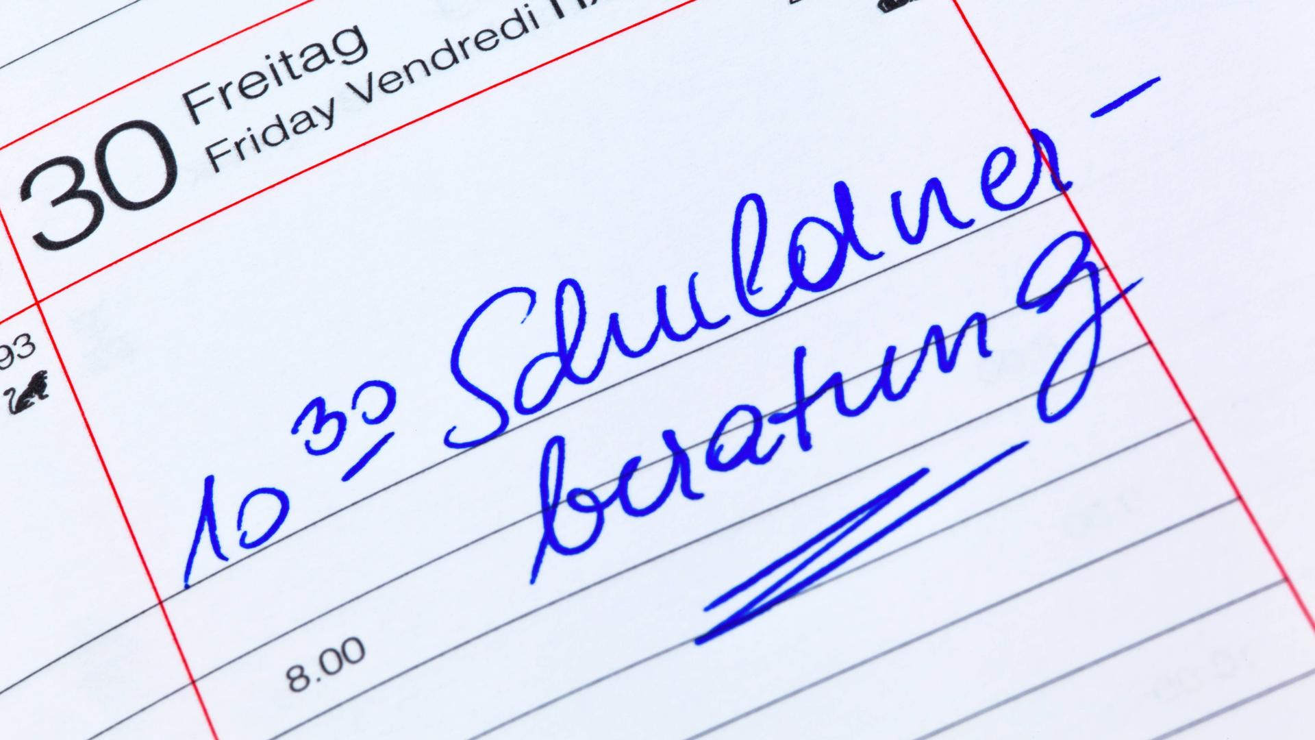 Termineintrag für eine Schuldnerberatung in einem Kalender.