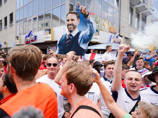 An England fan shows a placard of national coach Gareth Southgate during celebration ahead of a semi final match between Netherlands and England at the Euro 2024 soccer tournament in Dortmund, Germany, Wednesday, July 10, 2024. (AP Photo/Markus Schreiber)