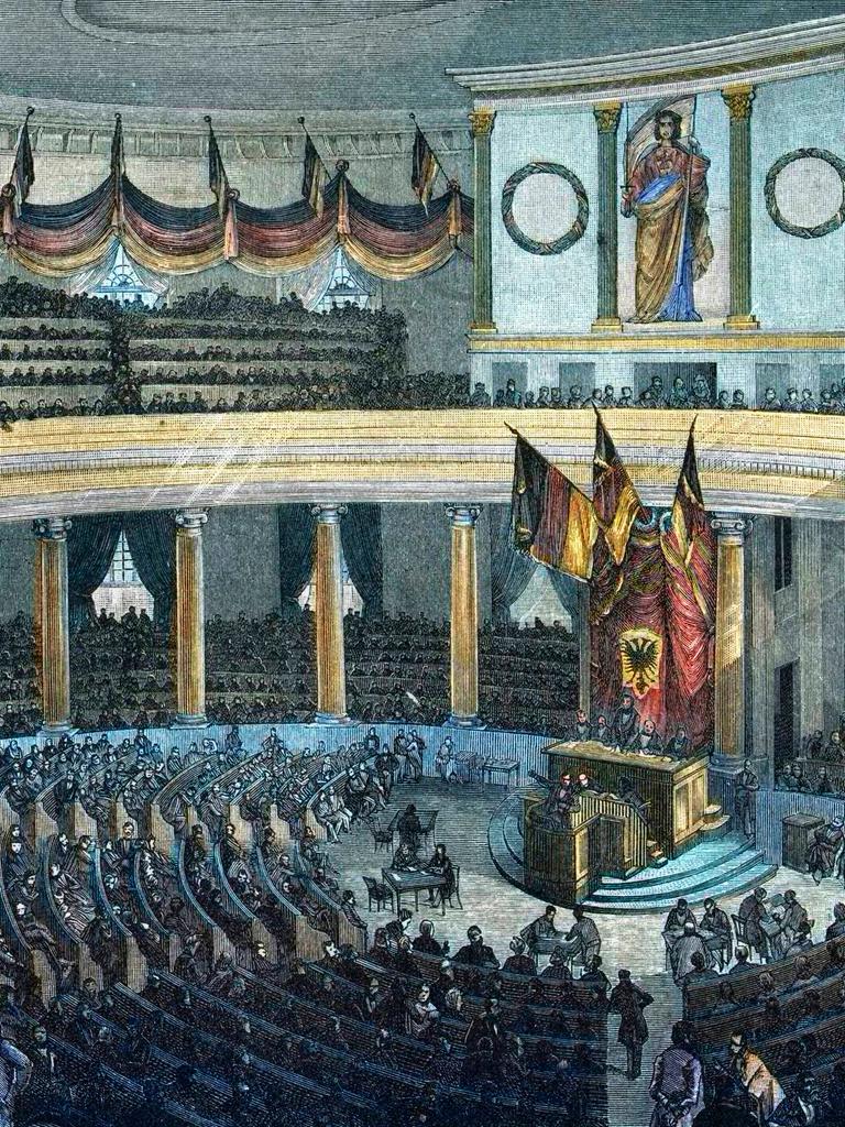 Die Frankfurter Nationalversammlung im Mai 1848. Zeitgenössischer, kolorierter Holzschnitt