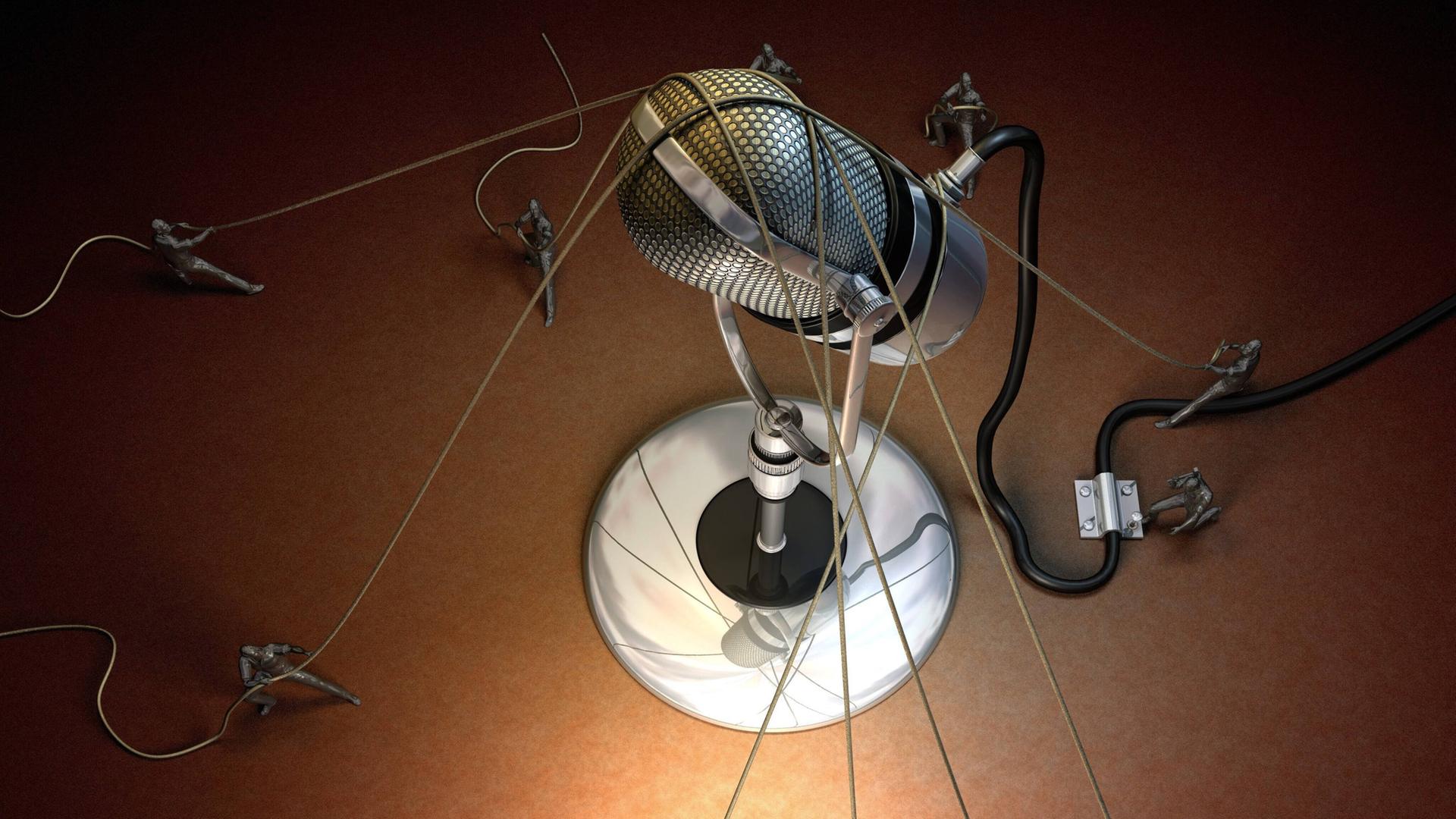  Illustration: Ein Mikrofon wird von vielen Seilen an Ort und Stelle gehalten.