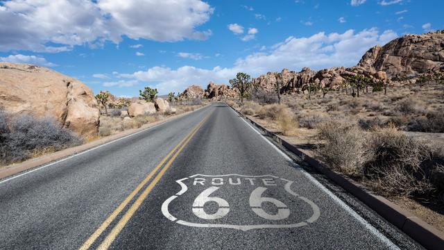 California  desert  Joshua  Tree  highway  with  Route  66  pavement  sign  and  clouds. xkwx route  66,  route,  66,  sign,  pavement,  desert,  highway,  joshua  tree,  joshua